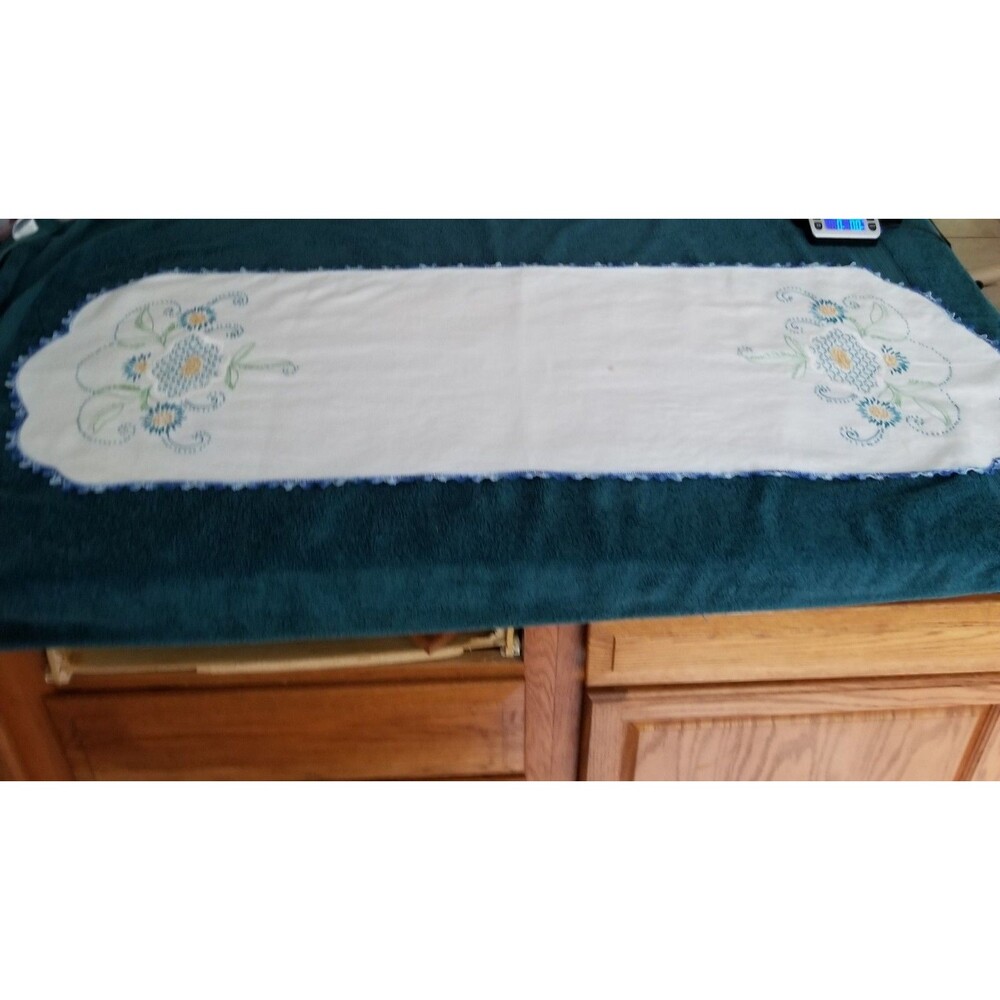 vintage handmade floral needlework table runner with a crocheted border